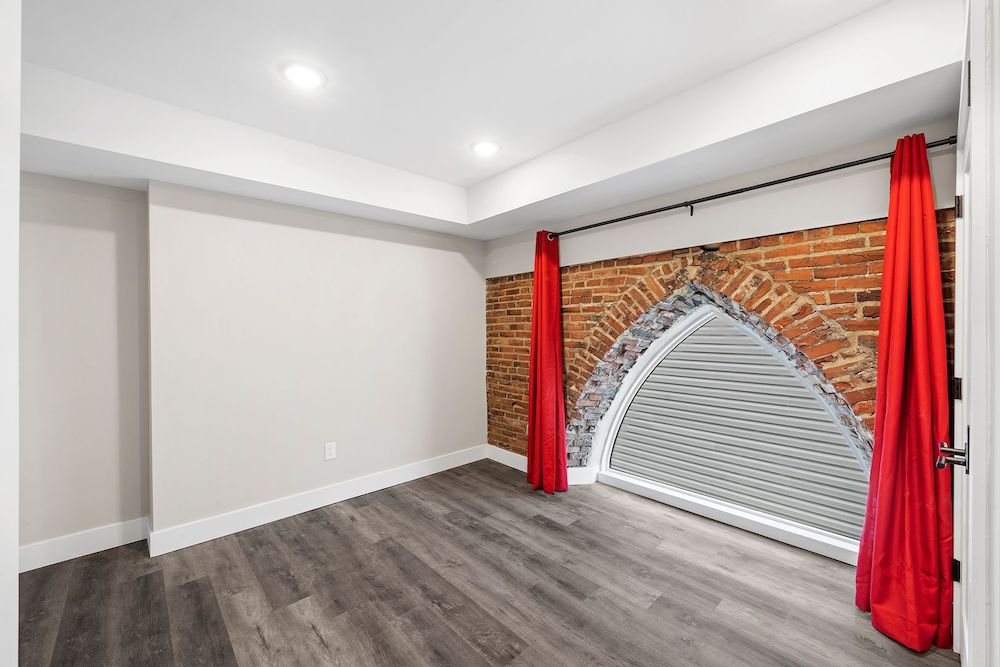 1732 n 22nd st - philadelphia - renovated church apartment for rent - bedroom red curtains